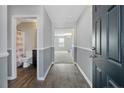 Home entryway with half bathroom and view into living room at 299 Hallow Oak St, Spring Lake, NC 28390