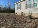 Landscaped side yard of manufactured home at 441 Hayes Rd, Spring Lake, NC 28390