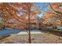 Brick home with autumn leaves and driveway at 51 Cedar Ln, Sanford, NC 27332