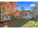 Brick and siding home with fall foliage at 51 Cedar Ln, Sanford, NC 27332