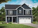 Two-story home with a navy blue exterior, black shutters, green grass and a two-car garage at 60 Bennett Rd, Coats, NC 27521