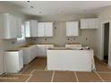 Modern white kitchen features ample cabinetry and an island at 6935 Old Jefferson Davis Hwy, Cameron, NC 28326