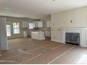 Open living area with fireplace and kitchen views at 6935 Old Jefferson Davis Hwy, Cameron, NC 28326