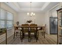 Dining room with wood table, chairs, and chandelier at 48 Cedarview Ct, Cameron, NC 28326