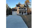 Two-story house with gray siding, black shutters, and a long driveway at 772 Roberts Rd, Sanford, NC 27332