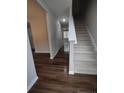 Modern staircase with dark hardwood floors and neutral wall colors at 788 Roberts Rd, Sanford, NC 27332
