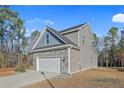 Side view of a two-story house with stone and siding at 886 Juno Dr, Broadway, NC 27505