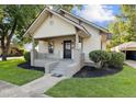 Renovated craftsman home with a covered porch and well-maintained landscaping at 205 N Layton Ave, Dunn, NC 28334