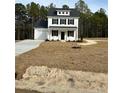 Two-story farmhouse style home with white siding, black shutters, and a gray roof at 806 Roberts Rd, Sanford, NC 27332