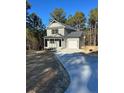 Two-story house with gray siding, black door, and attached garage at 826 Roberts Rd, Sanford, NC 27332