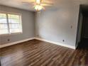 Spacious bedroom with hardwood floors and light-blue walls at 2712 Cameron Dr, Sanford, NC 27332