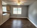 Dining area with hardwood floors and view into kitchen at 2712 Cameron Dr, Sanford, NC 27332