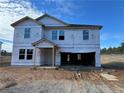 Under-construction two-story home with visible framing and window installation at 335 Greenbay St, Lillington, NC 27546