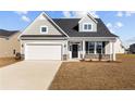 Attractive single-Gathering home showcases a two-car garage, neutral siding, and ample front yard space at 14 Willow Walk Way, Cameron, NC 28326