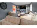 Cozy living room featuring sectional sofa and built-in shelving at 5618 Quail Ridge Dr, Sanford, NC 27332