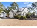 Charming home featuring manicured landscaping, a single-car garage, and a welcoming front entrance at 696 Valley Oak Dr, Bunnlevel, NC 28323