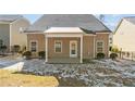 Rear view of home featuring a covered patio and fenced yard, perfect for outdoor activities at 137 Falls Creek Dr, Spring Lake, NC 28390