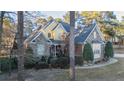 Brick and stone two-story home with landscaping and walkway at 14 Old Pine Ct, Spring Lake, NC 28390