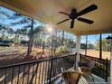 Relaxing balcony with wooded views and wicker seating at 62 Gallery Dr # 204, Spring Lake, NC 28390