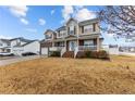 Two-story home with a large front yard and attached garage at 105 Caldwell St, Spring Lake, NC 28390