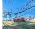 House's rear view, showcasing a large grassy yard at 108 George St, Dunn, NC 28334