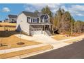 Two-story home with stone and gray siding at 174 High Woods Rdg, Chapel Hill, NC 27517