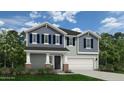 Two story house with gray vinyl shake siding, white trim, and a two car garage at 283 Rocking Horse Ln, Sanford, NC 27332