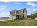 Two-story house with a landscaped yard and attached garage at 148 Cumberland Dr, Sanford, NC 27332