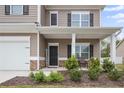 Front entrance with a covered porch and stone accents at 148 Cumberland Dr, Sanford, NC 27332