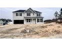 New construction home with gray siding, attached garage, and a large lot at 115 White Doe Crossing (Lot 623), Cameron, NC 28326