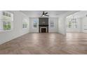 Bright living room featuring herringbone floors and a fireplace at 186 Mahogany Ct, Cameron, NC 28326