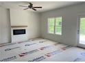 Bright living room with a cozy fireplace and views of the outdoors at 48 Tackett Ct, Lillington, NC 27546