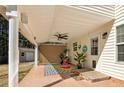 Covered patio with ceiling fan, outdoor rug, comfortable seating, and a view of the backyard at 511 Providence Hall Dr, Sanford, NC 27330