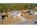 Aerial view of house and neighborhood, showcasing surrounding homes at 185 Leggett Dr, Cameron, NC 28326