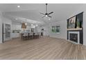 Open-concept kitchen with island, stainless steel appliances, and a farmhouse sink at 115 Mahogany Ct, Cameron, NC 28326