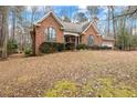 Brick house with attached garage and a large backyard at 1156 Deerfoot Trl, Sanford, NC 27332