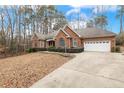 Brick house with attached garage and a long driveway at 1156 Deerfoot Trl, Sanford, NC 27332