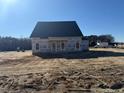 New construction home with a gray roof and front porch at 123 Surles Landing Way, Benson, NC 27504