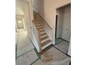 Newly constructed staircase with wooden steps and white banister at 123 Surles Landing Way, Benson, NC 27504