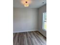 Bright bedroom with a large window offering natural light at 145 Surles Landing Way, Benson, NC 27504
