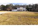 Two-story house with attached garage and a spacious front yard at 287 Cypress Creek Farm Rd, Sanford, NC 27332