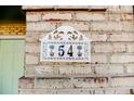 Image of house number 54 on a brick wall at 54 Red Holly Dr, Sanford, NC 27330