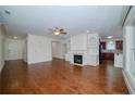 Spacious living room with hardwood floors, built-in shelving, fireplace, and abundant natural light at 1222 Waterford Lake Dr, Cary, NC 27519