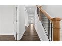 Bright foyer with hardwood floors and elegant staircase at 38 Steeple Rdg, Cameron, NC 28326