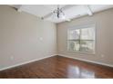 Bright dining room with hardwood floors and a large window at 106 Birch Ave, Spring Lake, NC 28390