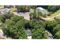 House nestled in woods near a country club with pool and tennis courts at 15 The Pointe, Sanford, NC 27332
