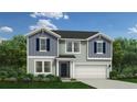 A charming two-story home with gray siding, dark shutters, and manicured front yard at 352 Rocking Horse Ln, Sanford, NC 27332