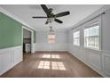 Bright living room with hardwood floors and wainscoting at 206 Justice Heights St, Apex, NC 27502