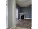 Gray walls, fireplace, wood-look floors at 2510 Friedland Pl # 200, Raleigh, NC 27617