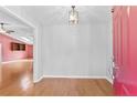 Bright foyer with hardwood floors and a stylish light fixture at 48 Indian Trl, Sanford, NC 27332